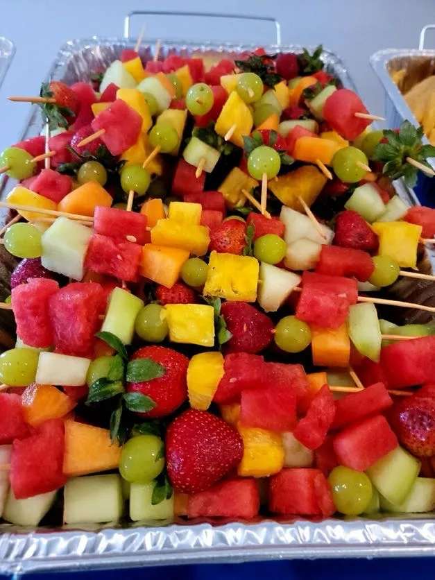 Fruit kabobs with strawberries, melon, and grapes